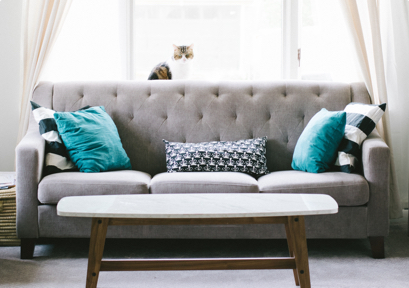 grey colored sofa